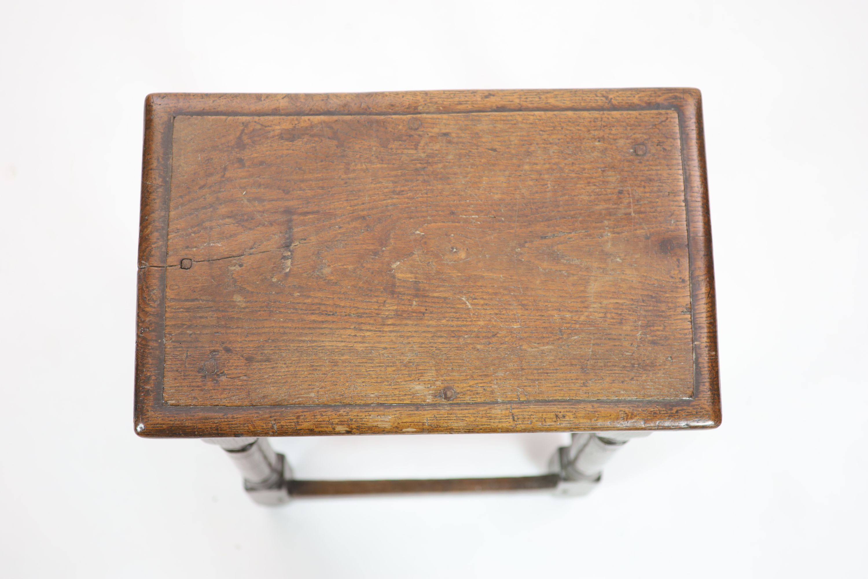 A mid-17th century oak joint stool H 58cm. W 48cm. D 30cm.